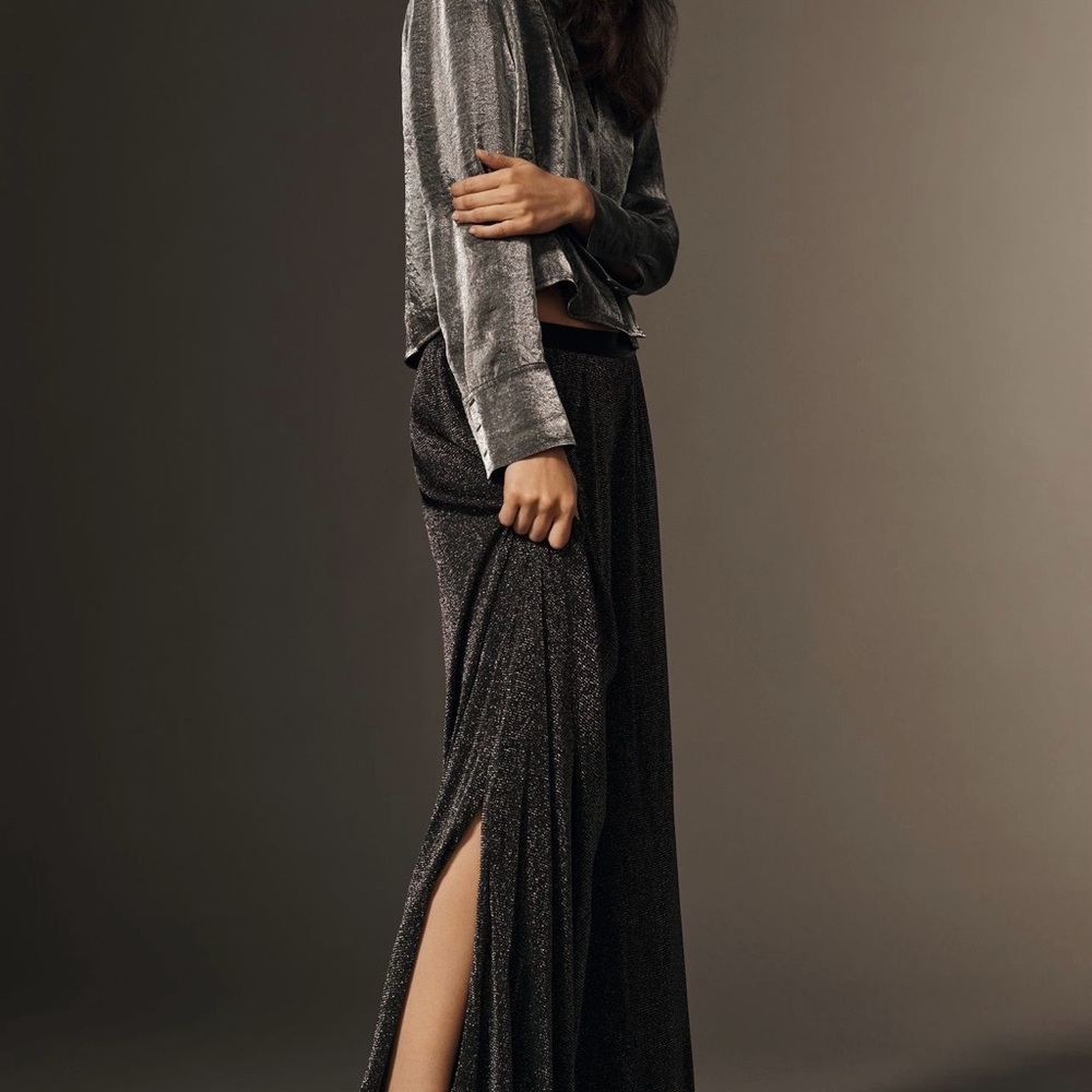 Anthropologie Metallic Black wide leg pants. New with tag .